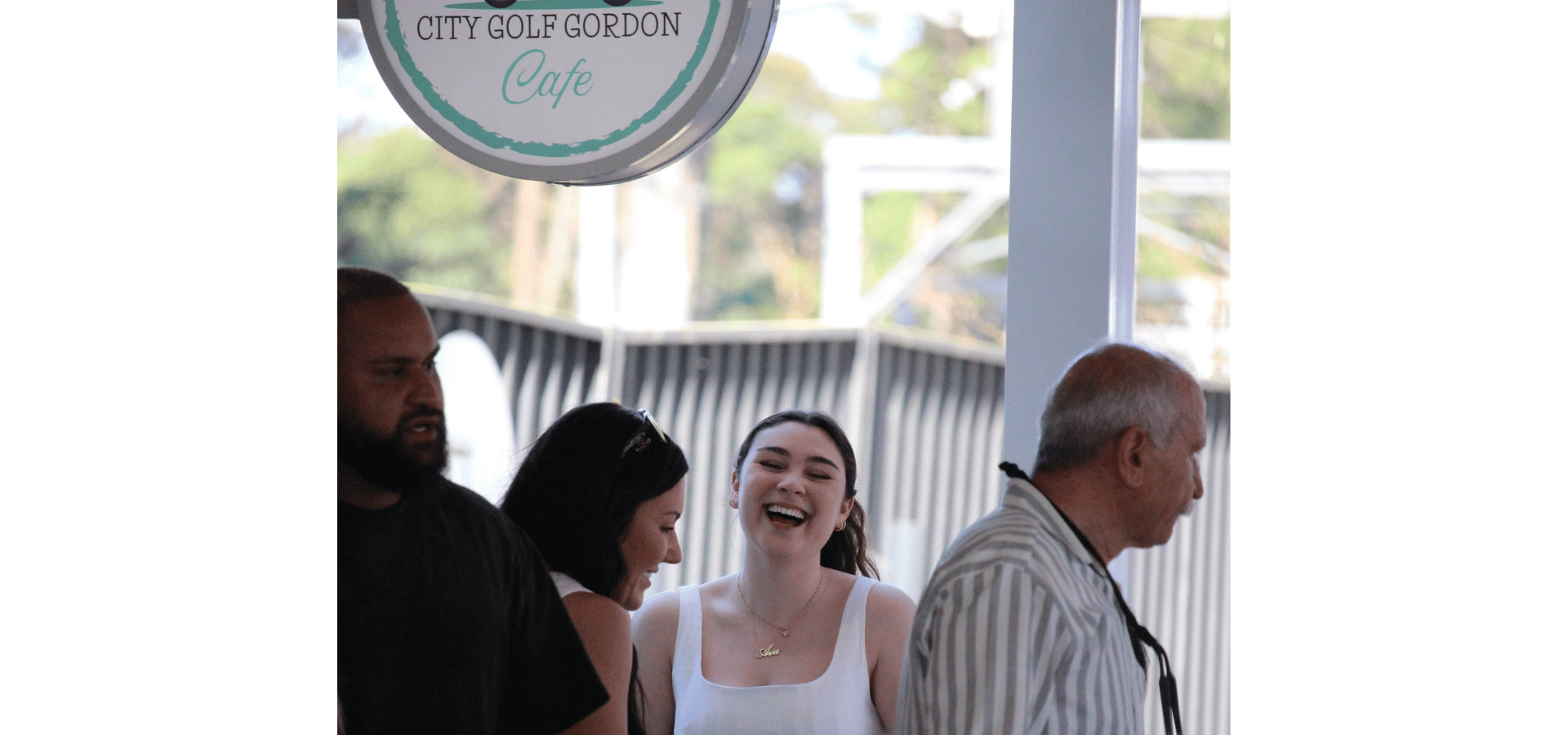A group celebrating together at City Golf Gordon